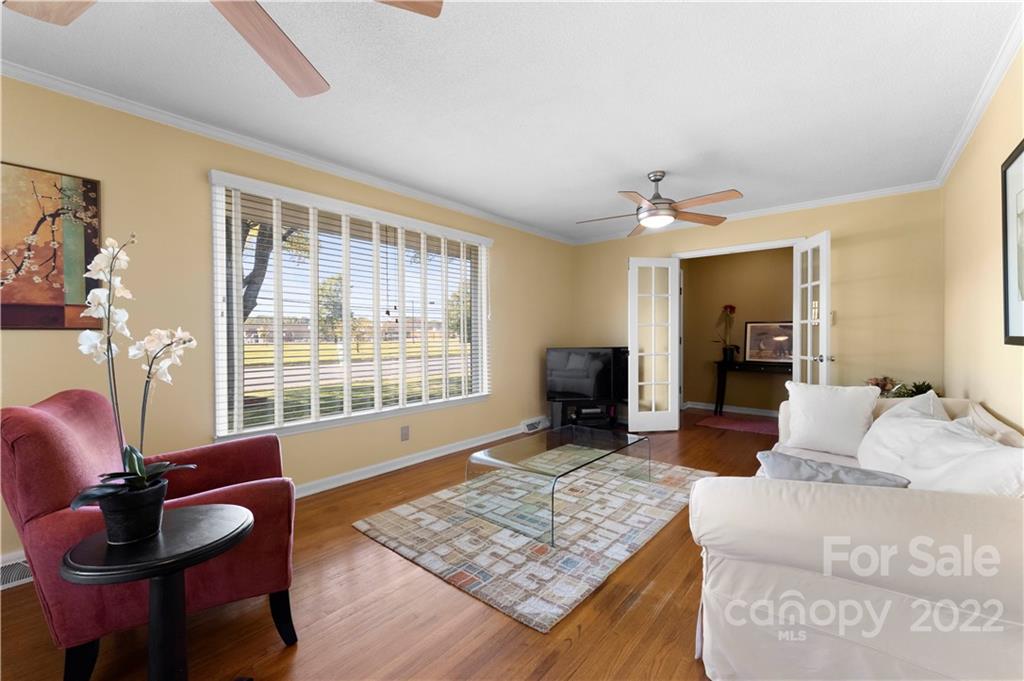 1705 Tyvola Road Charlotte, NC 28210 - Photo 31 of 40 a living room with furniture and a fireplace