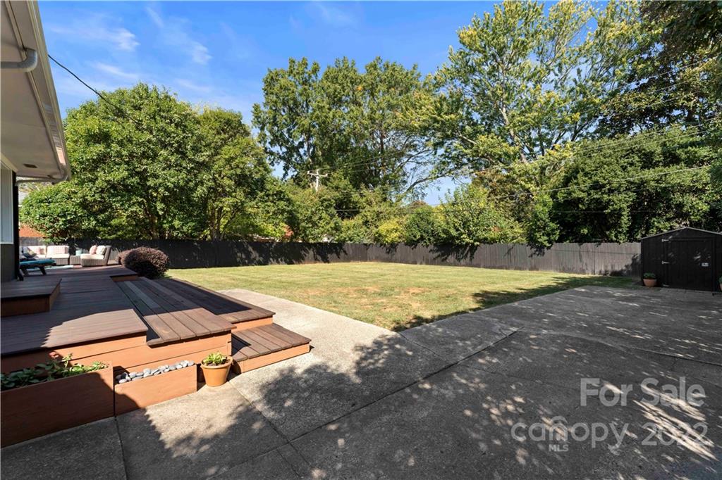 1705 Tyvola Road Charlotte, NC 28210 - Photo 35 of 40 a view of a swimming pool with an outdoor space and seating area