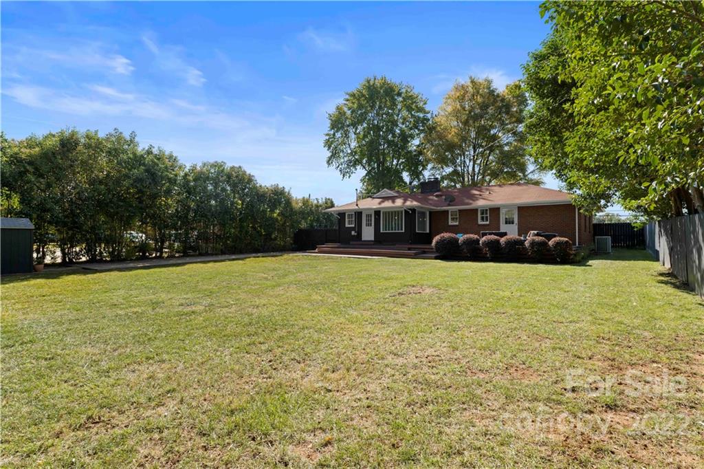1705 Tyvola Road Charlotte, NC 28210 - Photo 40 of 40 a front view of a house with a yard table and trees