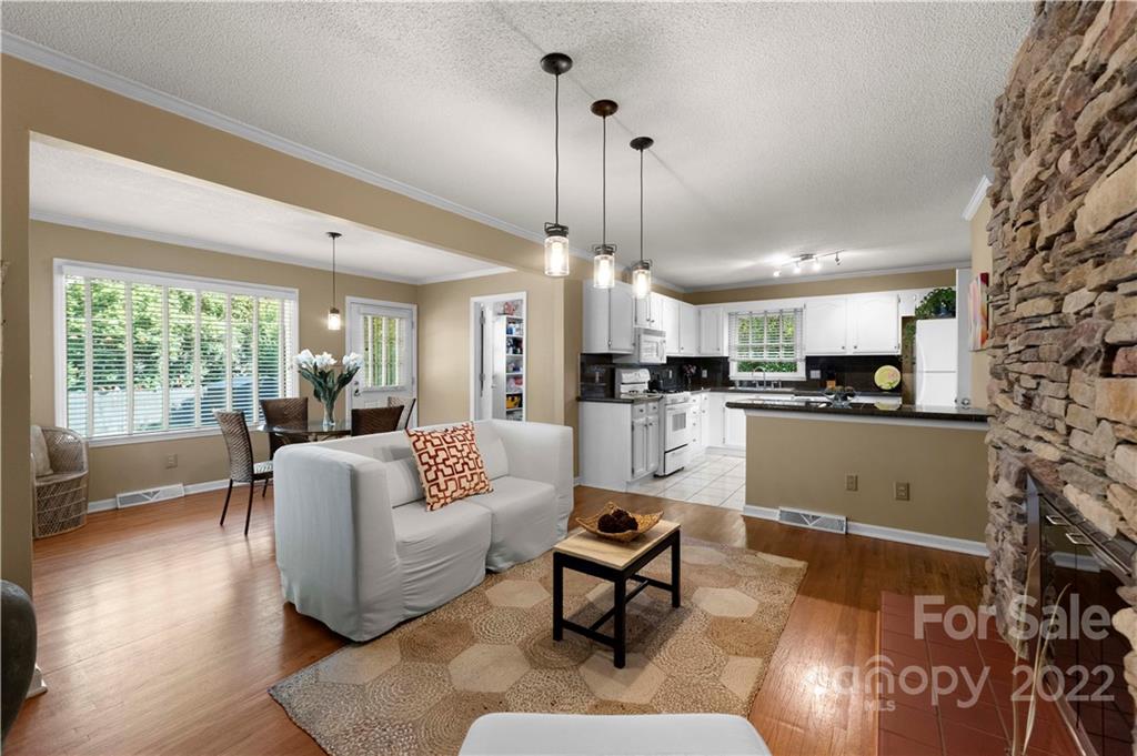 1705 Tyvola Road Charlotte, NC 28210 - Photo 8 of 40 a living room with furniture and kitchen view