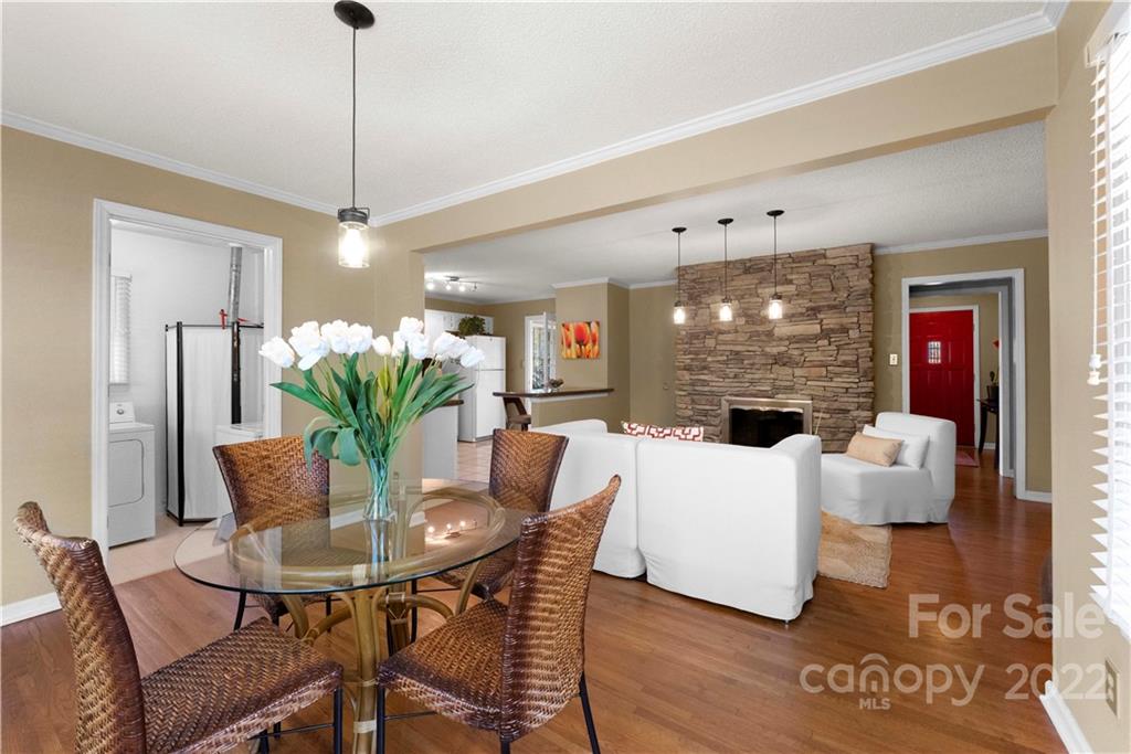 1705 Tyvola Road Charlotte, NC 28210 - Photo 9 of 40 a view of a dining room with furniture and wooden floor