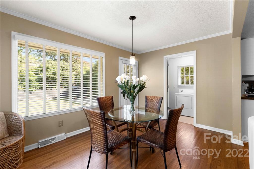 1705 Tyvola Road Charlotte, NC 28210 - Photo 10 of 40 a dining room with furniture window and wooden floor