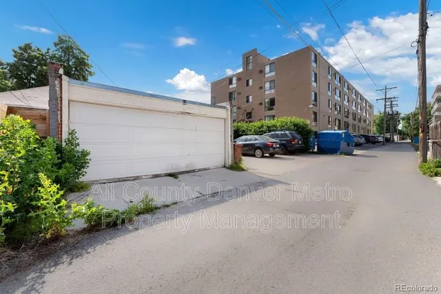 a view of a street with a building in the background