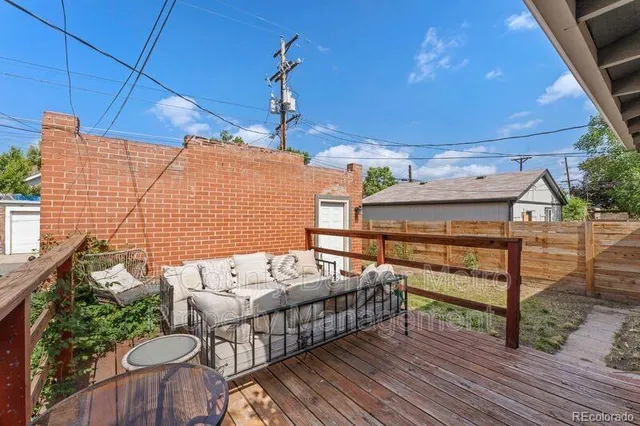 a view of a patio with table and chairs