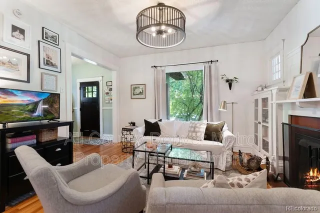 a living room with furniture fireplace and a flat screen tv