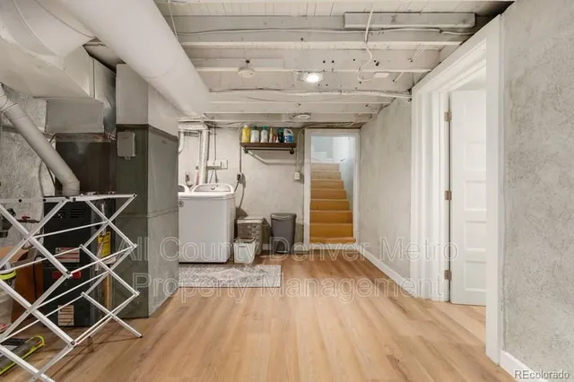 a view of a room with wooden floor