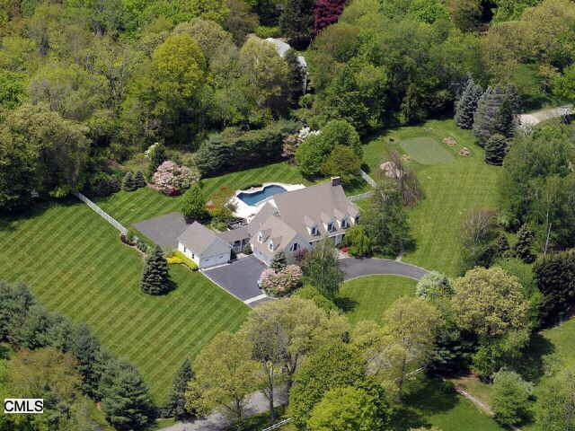 183 Catalpa Road Wilton, CT 06897 - Photo 1 of 1 an aerial view of residential house with outdoor space and trees all around