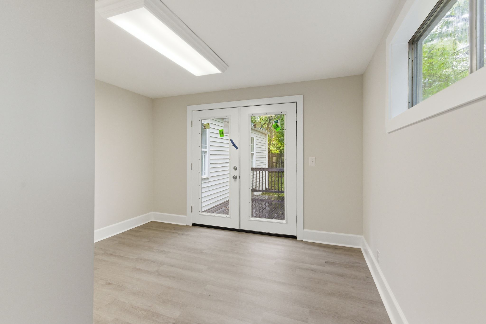 305 South Irwin Street Manchester, TN 37355 - Photo 18 of 40 an empty room with wooden floor closet and windows
