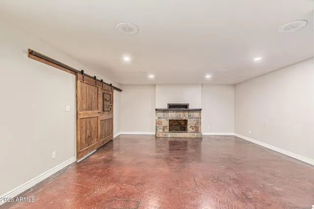 a view of kitchen with stainless steel appliances a refrigerator and stove top oven