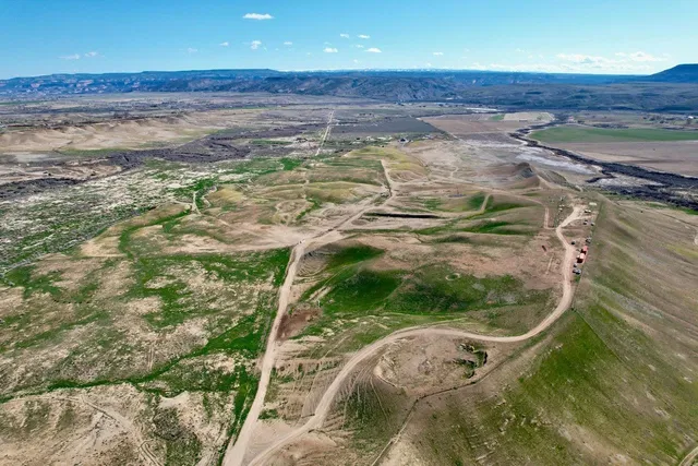 a view of a swimming pool with a yard