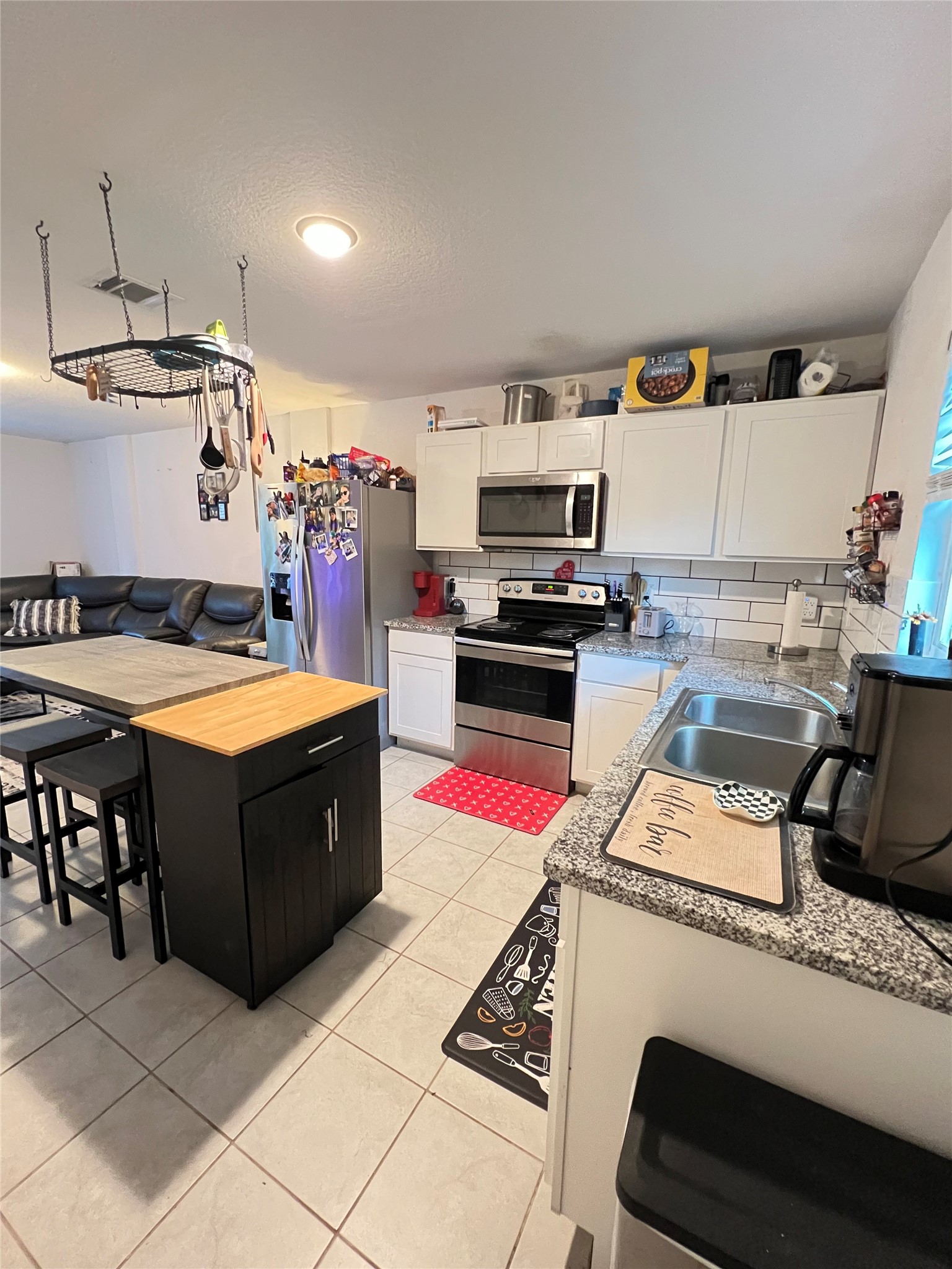 4139 Sam Houston Road Willis, TX 77378 - Photo 10 of 26 The kitchen has new cabinets and gorgeous granite countertops.