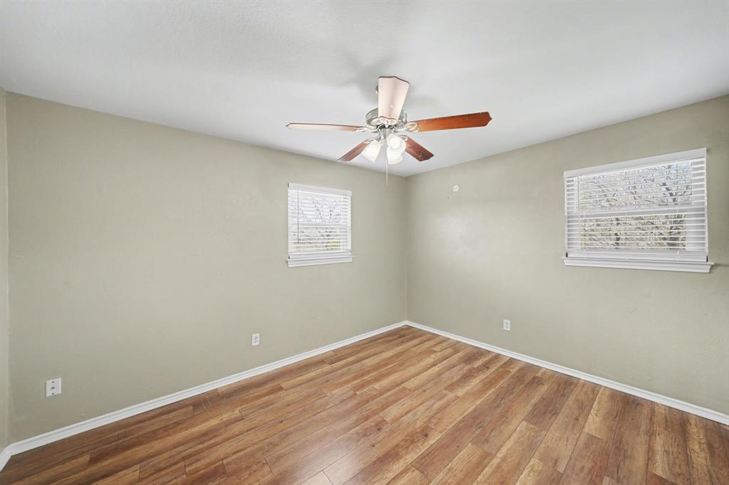 6925 Calender Road, Unit A Arlington, TX 76001 - Photo 18 of 19 a view of a room with a fan & a window