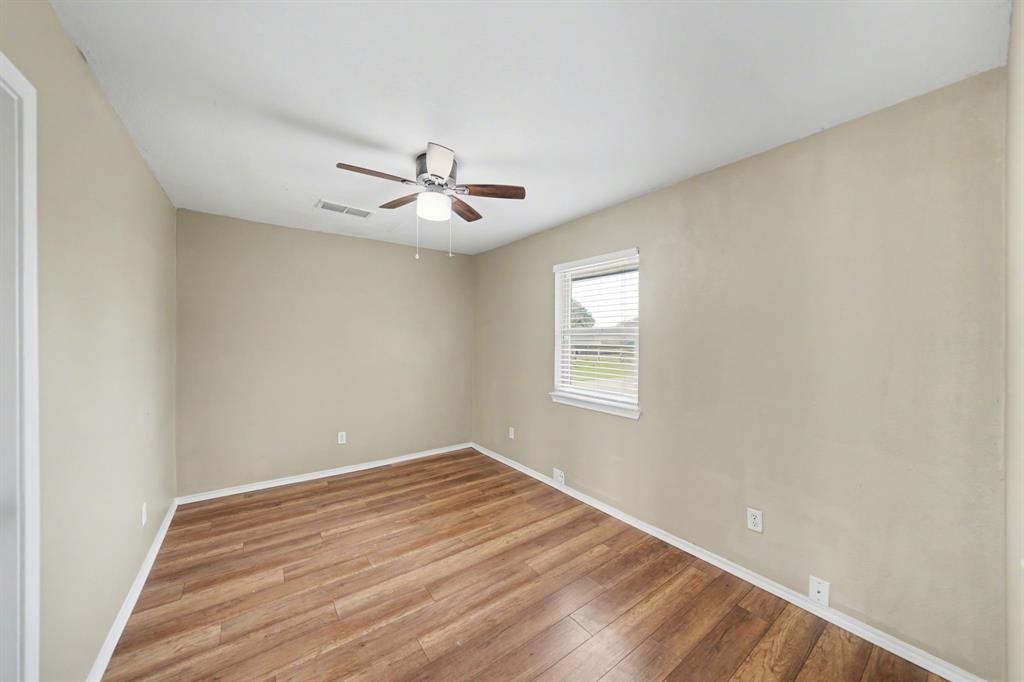 6925 Calender Road, Unit A Arlington, TX 76001 - Photo 10 of 19 a view of a room with a window and a ceiling fan