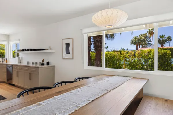 a kitchen with a table and chairs