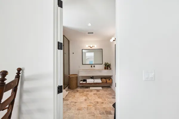 a bathroom with a sink and a mirror