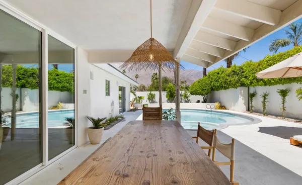 a view of a terrace with furniture and a potted plant