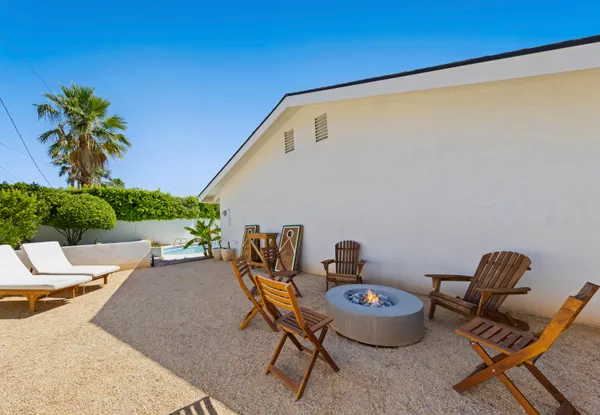 a aerial view of a house with swimming pool and plants