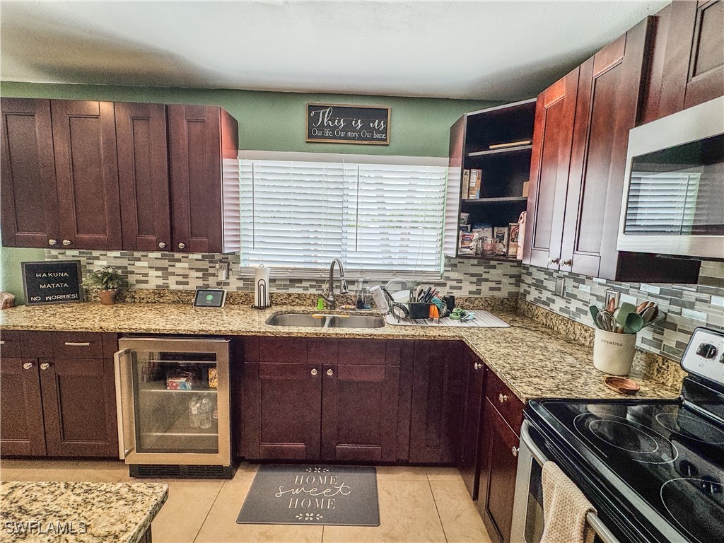 4002 Cascade Lane LaBelle, FL 33935 - Photo 10 of 23 a kitchen with a sink stove and cabinets