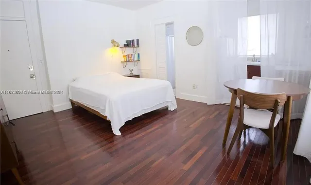 a bedroom with a bed and a table in it