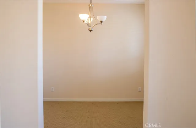 a view of entryway and hall with a fireplace