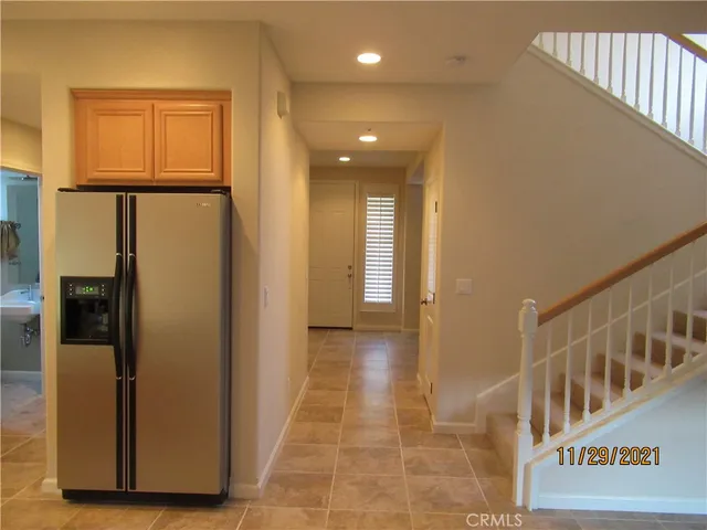 a kitchen with a stove a refrigerator and a sink