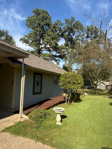 a front view of a house with yard