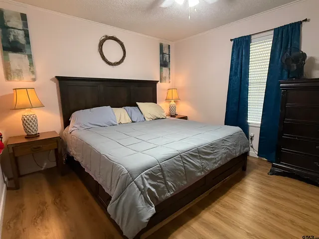 a bedroom with a bed and window