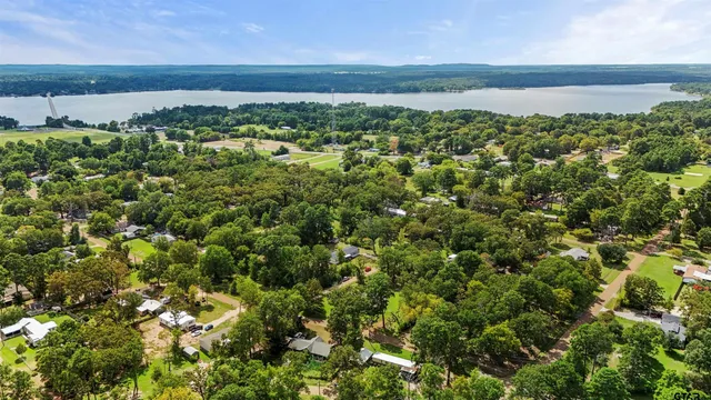 an aerial view of a houses with a yard