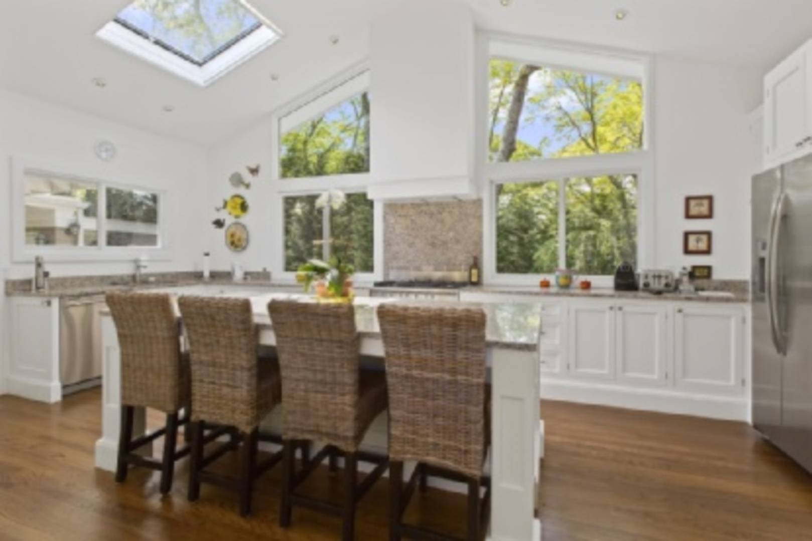 182 Cove Hollow Road East Hampton, NY 11937 - Photo 3 of 14 a dining table with chairs and window