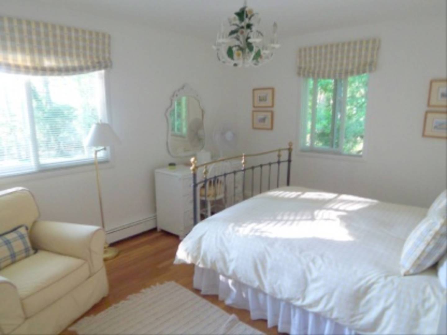 182 Cove Hollow Road East Hampton, NY 11937 - Photo 5 of 14 a bed sitting in a bedroom next to a window
