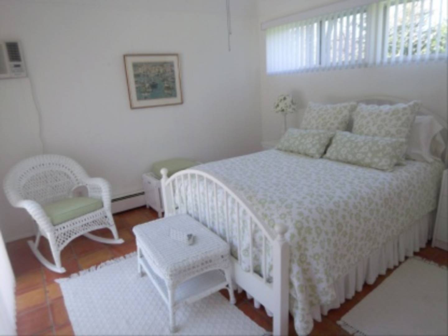 182 Cove Hollow Road East Hampton, NY 11937 - Photo 7 of 14 a bedroom with a bed and a chair