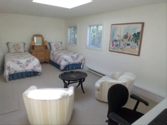 a living room with furniture and a chair