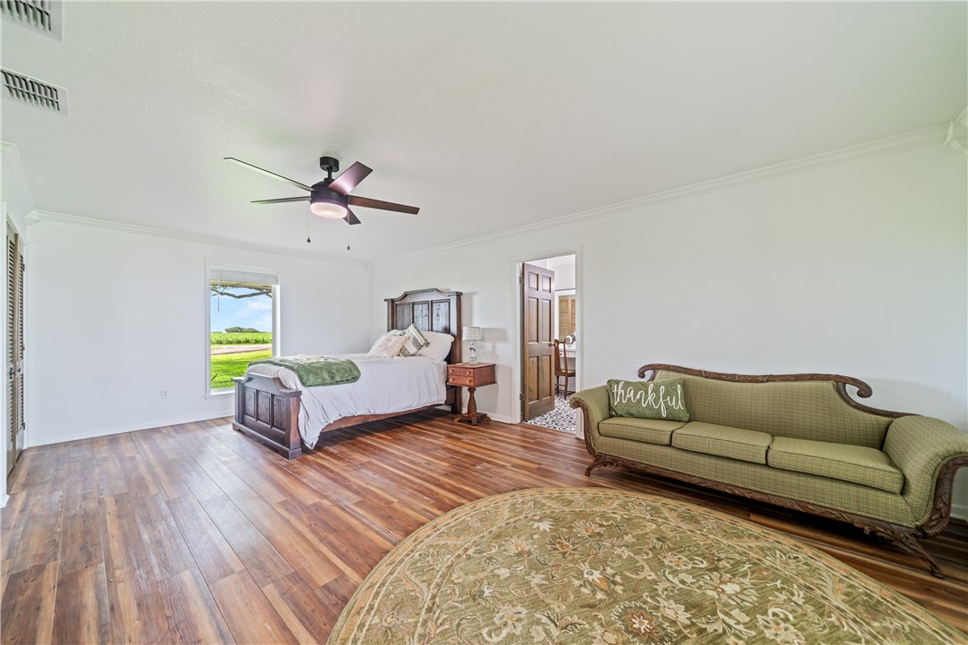 501 South County Road 1140 Riviera, TX 78379 - Photo 17 of 40 Spacious first-floor primary bedroom featuring woo