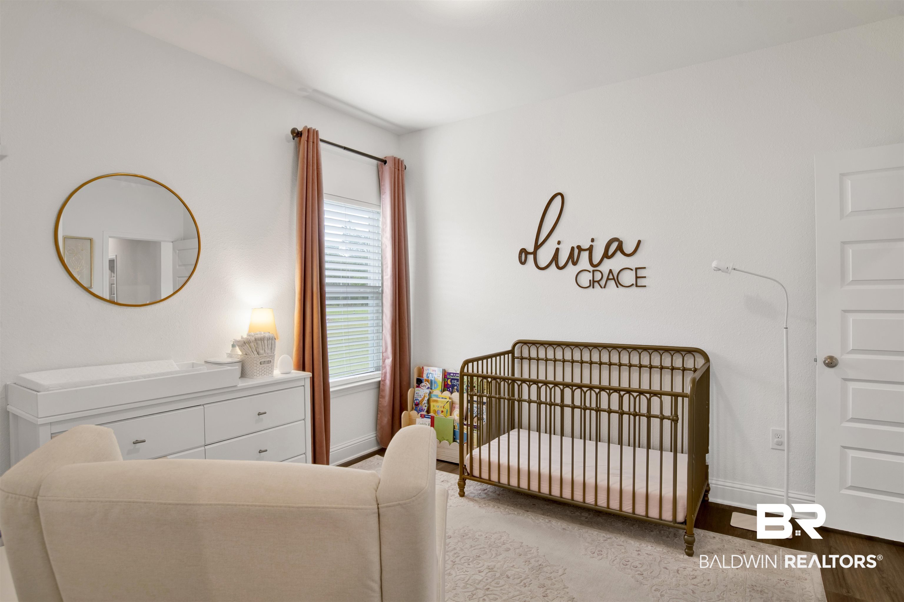 594 Shepard Street Gulf Shores, AL 36542 - Photo 4 of 51 Bedroom with a crib and wood finished floors