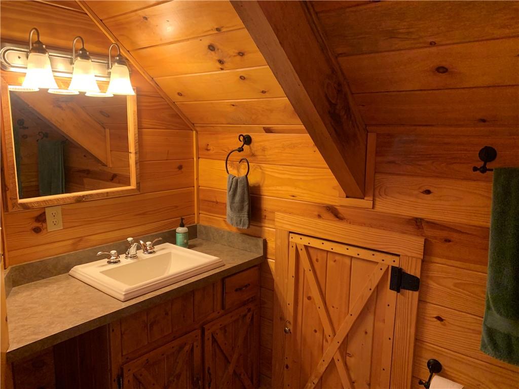 101 Cabin Road Normalville, PA 15469 - Photo 18 of 36 a bathroom with a sink and mirror