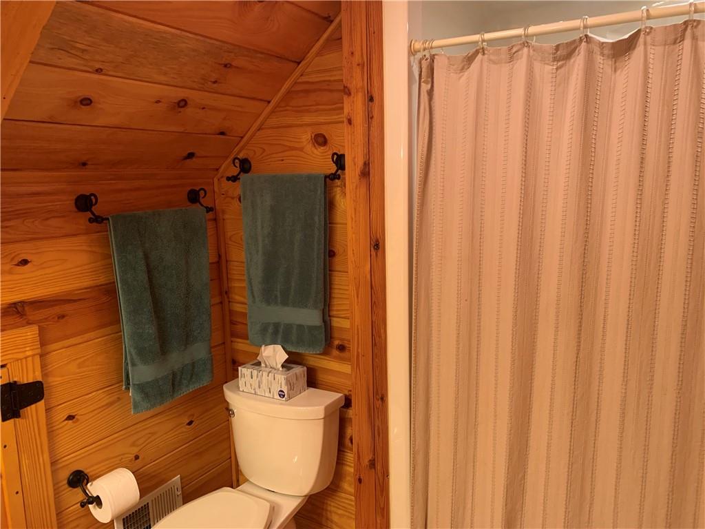101 Cabin Road Normalville, PA 15469 - Photo 19 of 36 a bathroom with a toilet and shower curtain