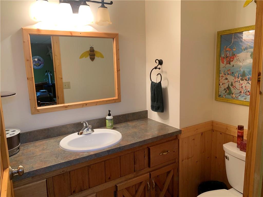 101 Cabin Road Normalville, PA 15469 - Photo 25 of 36 a bathroom with a granite countertop sink and a mirror