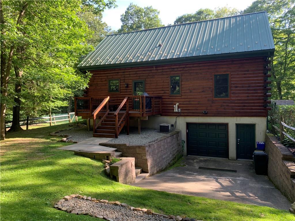101 Cabin Road Normalville, PA 15469 - Photo 27 of 36 a front view of a house with garden