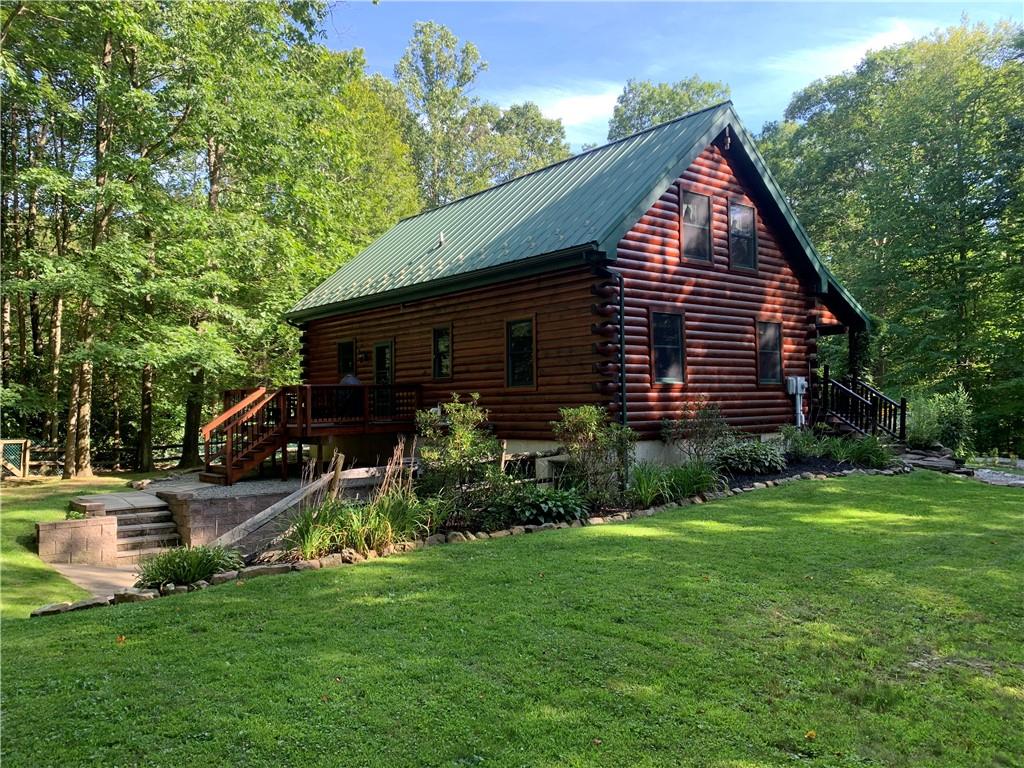 101 Cabin Road Normalville, PA 15469 - Photo 29 of 36 a front view of a house with garden