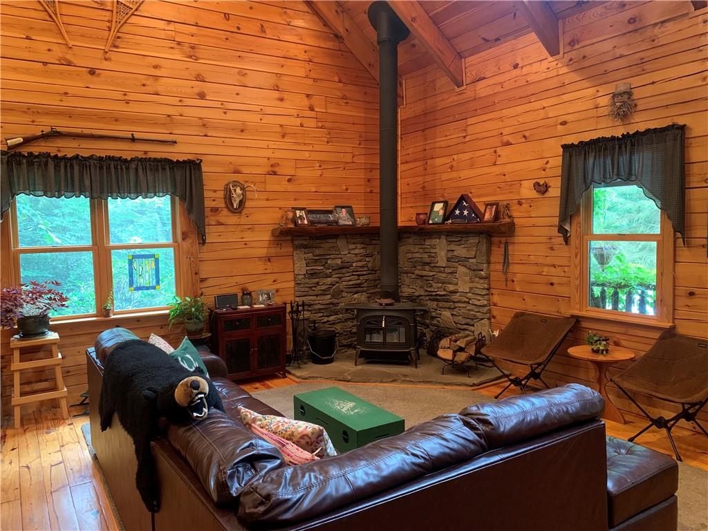 101 Cabin Road Normalville, PA 15469 - Photo 3 of 36 a view of a patio with couches chairs and wooden floor