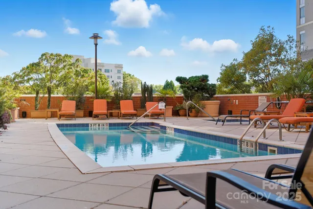 a view of a swimming pool with chairs