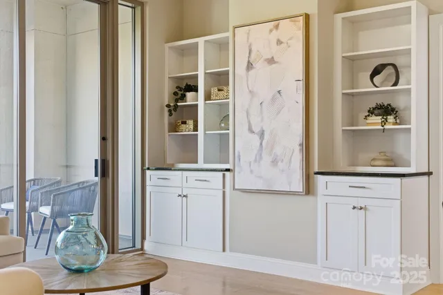 a room with cabinets and painting on the wall