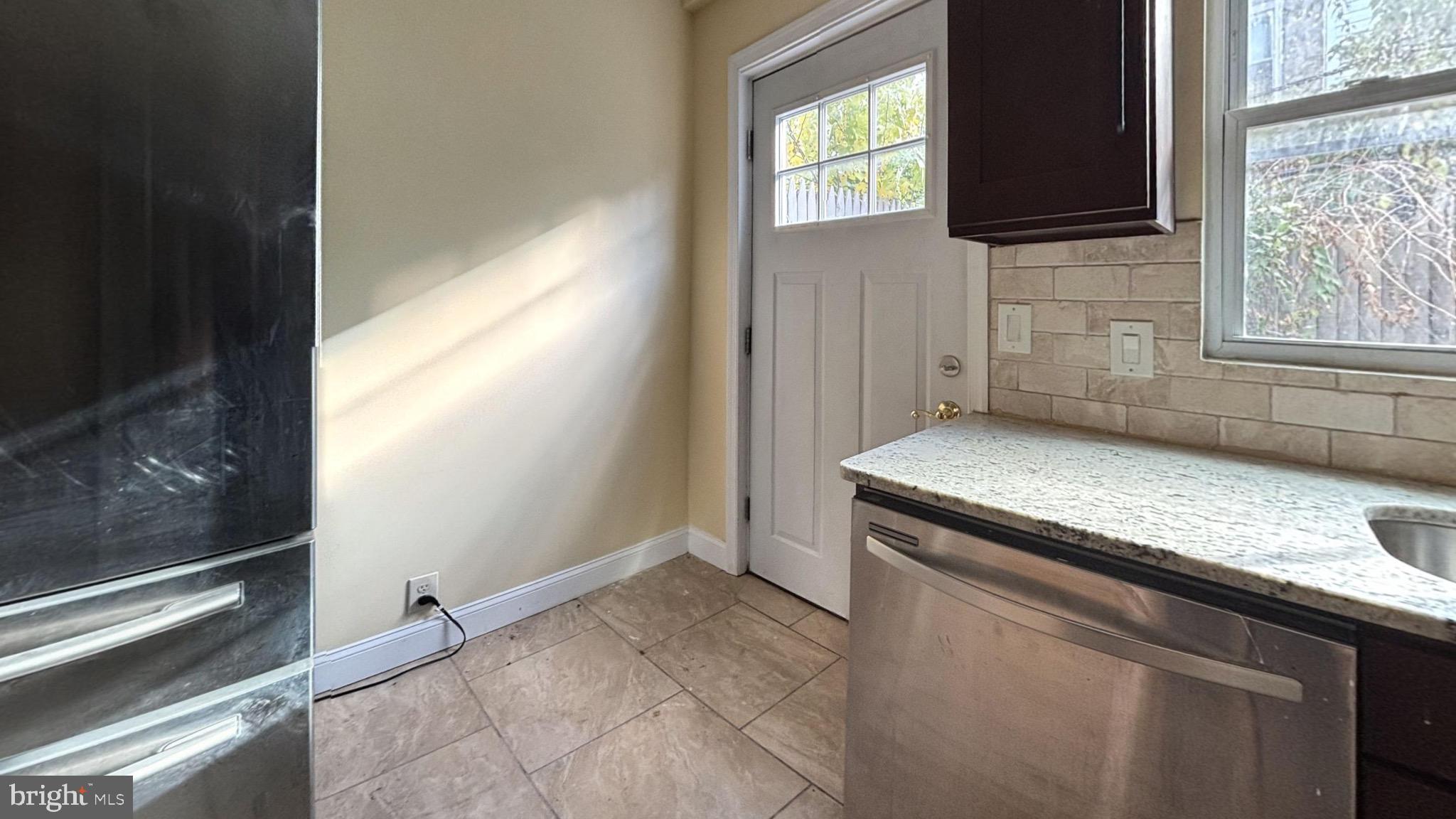 2338 Cross Street Philadelphia, PA 19146 - Photo 4 of 7 a view of a kitchen that has a sink and a stove