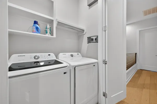 a bathroom with a granite countertop toilet sink and mirror