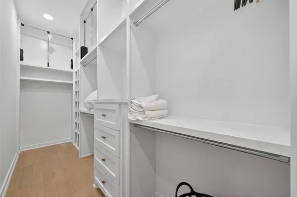 a view of a house with a yard and wooden fence