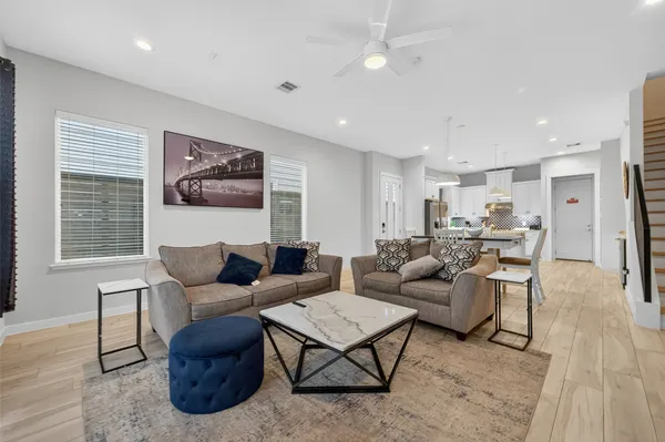 a living room with furniture and a table