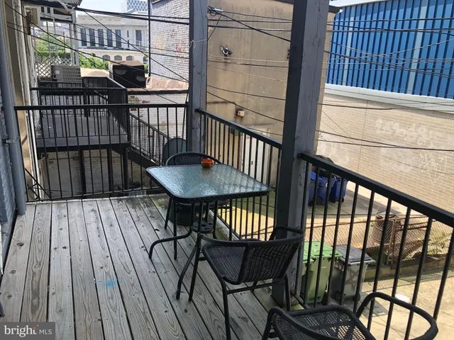 a view of balcony with wooden floor
