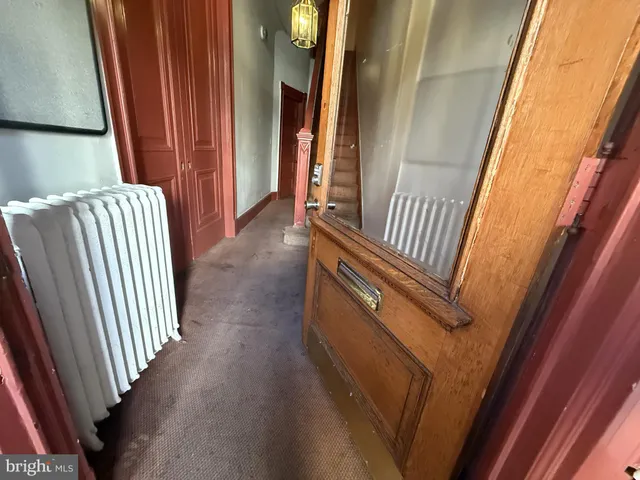 a view of a hallway with staircase