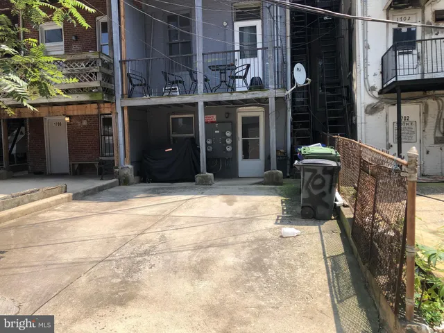 a view of a wooden door of a house with washer and dryer