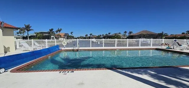 a kitchen with stainless steel appliances a refrigerator sink and cabinets